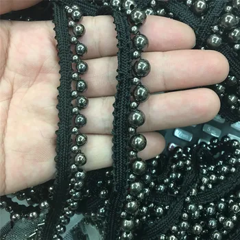 Vienos eilės pilka granulių rankų nagų granulių juoda nėrinių rankogaliai sijonas, suknelė nėrinių apdaila priedai, nacionaliniu mastu apdailos reikmenys